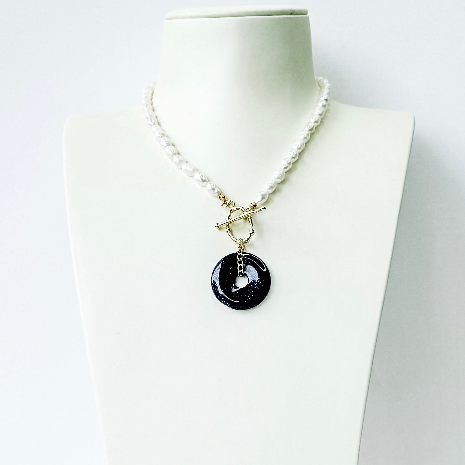 Black Pi disc on pearl chain with toggle necklace