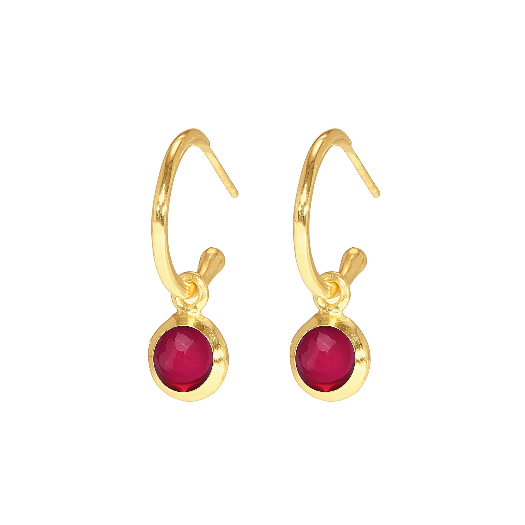 Gold hoop earrings with small red round gemstone charm