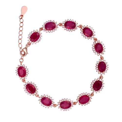 A bracelet featuring faceted rubies surrounded by white topaz brilliants, with a lobster clasp closure.
