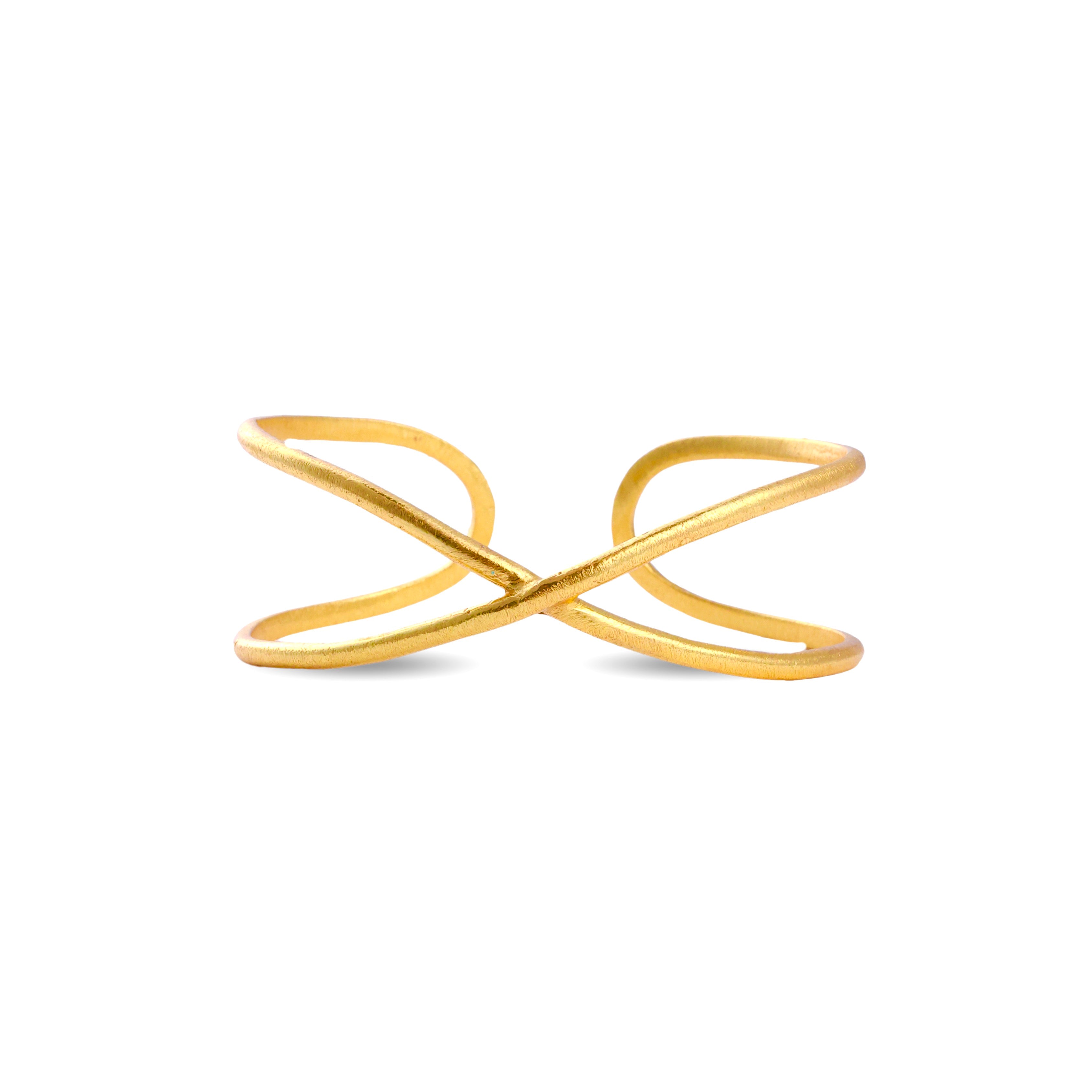 Minimal open gold cuff bracelet with crossed design