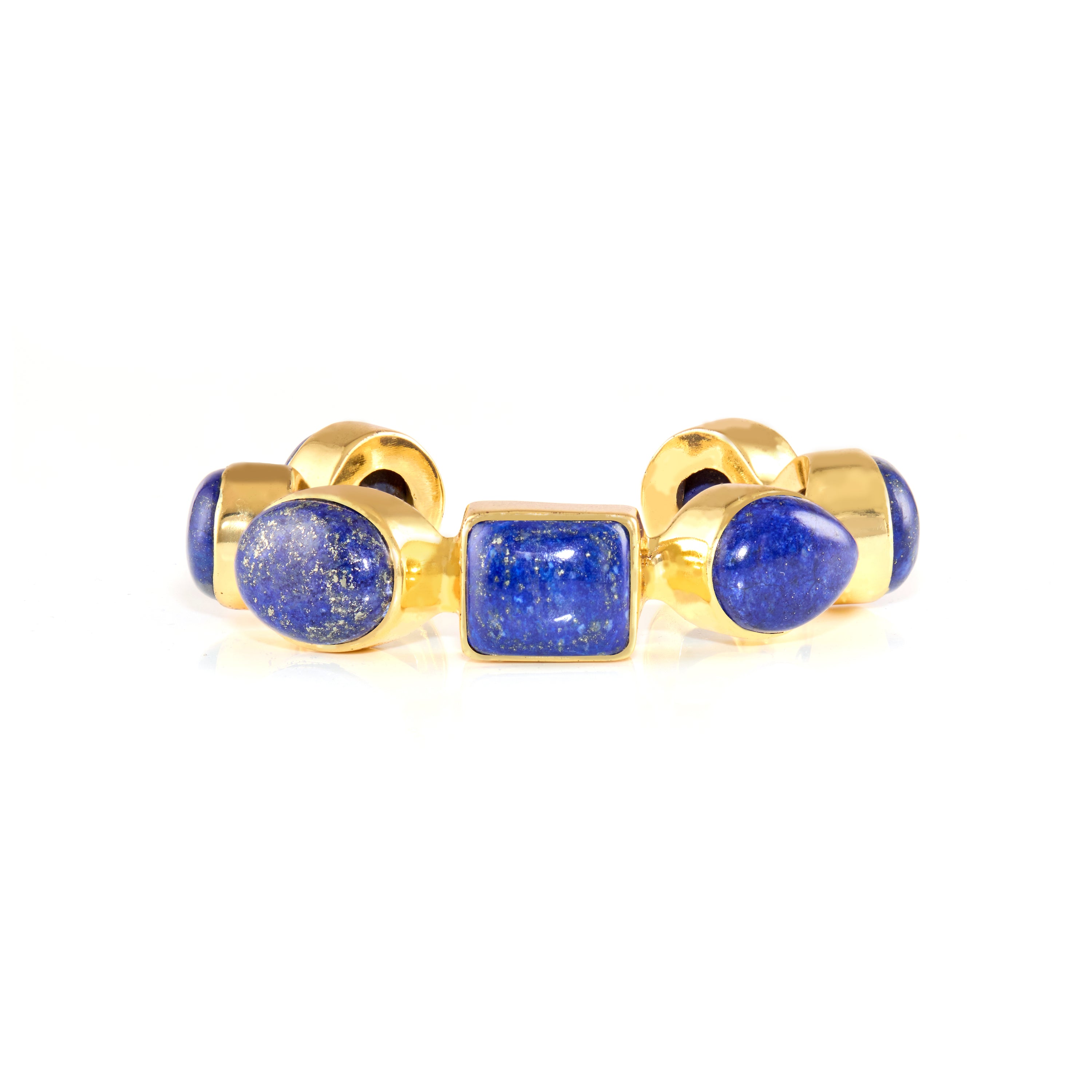 Gold ring featuring three blue gemstone settings